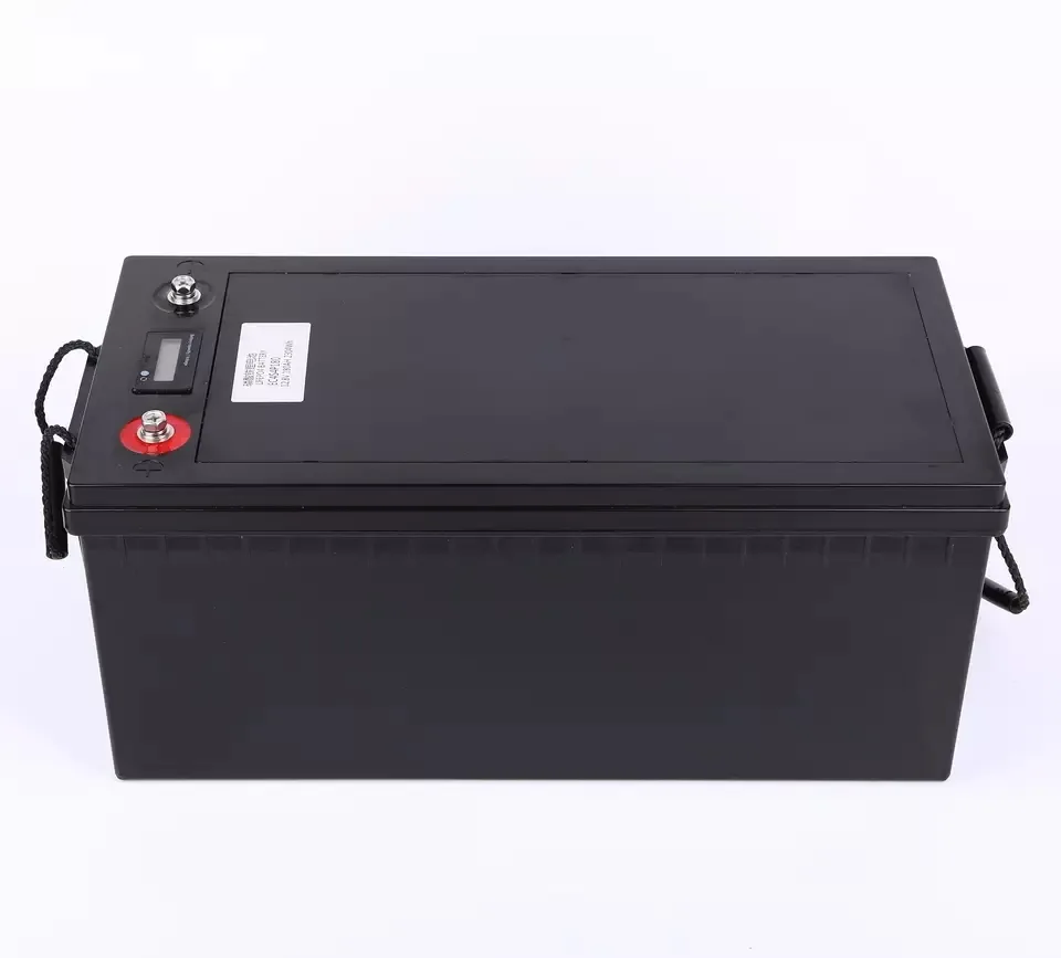 12.8V 200Ah LiFePO4 Battery — Steel Case with LCD Display Black LiFePO4 battery case with a built-in LCD display on the top panel, red and black terminals, a specification label and rope carry handles